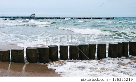 Amazing Landscape With Wooden Groynes And Running Waves At The Baltic Sea 126355219