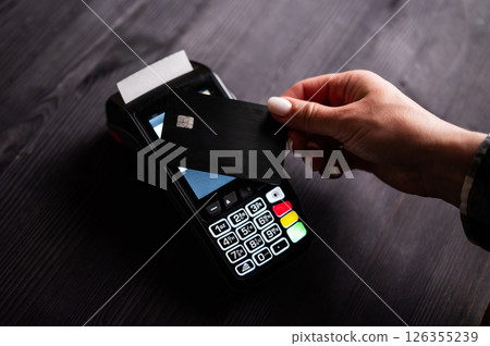 Girl Paying By Credit Card With Wireless Pos Terminal 126355239