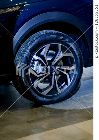 Car wheel with brake calipers and stylish design. 126355351