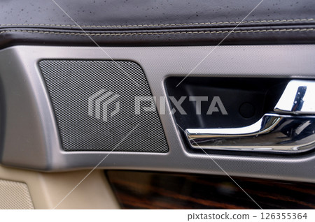 Close-up of control buttons on the door of a modern car. Close-up of control buttons on the door of a modern car. 126355364
