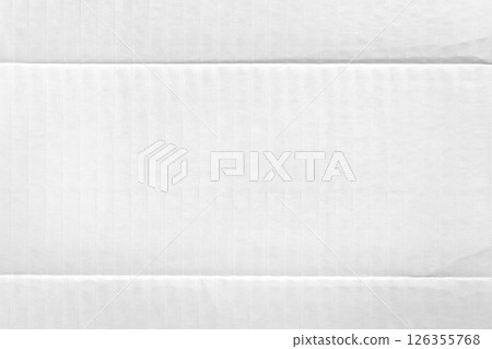 White abstract paper background of packaging cardboard with fold lines. Soft corrugated material 126355768