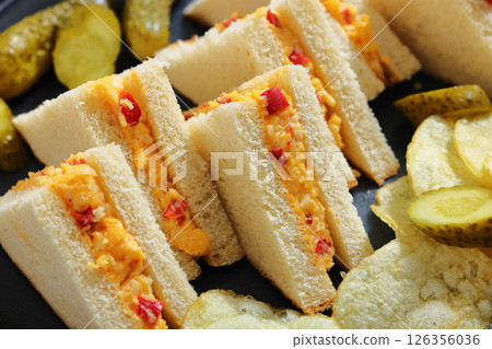 pimento cheese sandwiches with pickles and chips 126356036