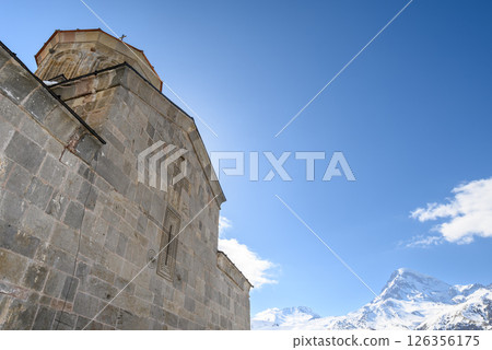 Gergeti Trinity Church and Mount Kazbek near the village of Stepantsminda in the Caucasus mountains in Georgia 126356175