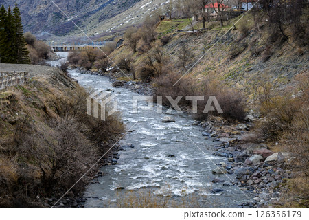 Town of Stepantsminda and Terek river valley on the Georgian Military Road, major route through the Caucasus mountains from Georgia to Russia Town of Stepantsminda and Terek river valley on the Georgian Military Road, major route through the Caucasus mountains from Georgia to Russia 126356179