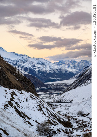 Terek river valley and mountain pass on the Georgian Military Road, major route through the Caucasus from Georgia to Russia 126356181