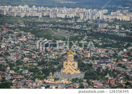 Holy Trinity Cathedral dominates the cityscape aerial view of Tbilisi, Georgia, view from Mtatsminda Park hill 126356345