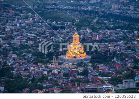 Night view of illuminated Holy Trinity Cathedral and the cityscape of Tbilisi, the capital of Georgia 126356528
