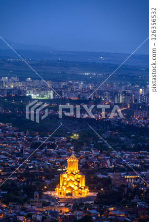 Night view of illuminated Holy Trinity Cathedral and the cityscape of Tbilisi, the capital of Georgia 126356532
