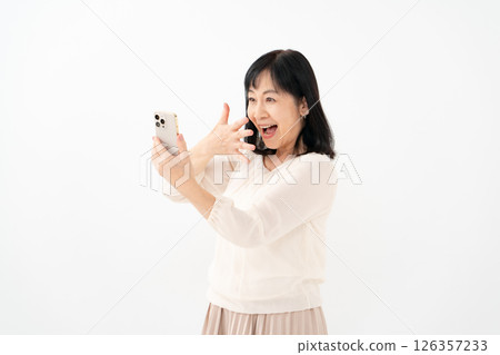 Senior woman, smartphone, smile, surprised 126357233