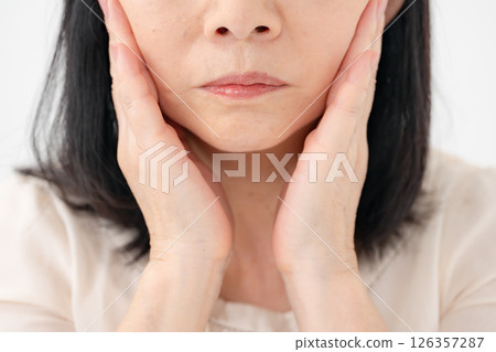 Senior woman, sagging cheeks 126357287