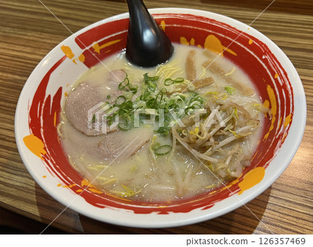 Photographing a bowl of delicious tonkotsu ramen in a ramen shop 126357469