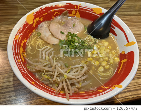 Photographing a bowl of delicious tonkotsu ramen in a ramen shop Photographing a bowl of delicious tonkotsu ramen in a ramen shop 126357472