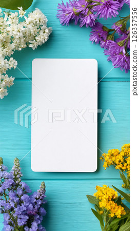 Blank tarot card for mockup surrounded by colorful flowers on a vibrant blue background Blank tarot card for mockup surrounded by colorful flowers on a vibrant blue background 126357556