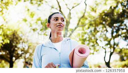 Fitness, woman or walking with yoga mat at park for wellness workout, thinking or ready for pilates. Below, yogi or thoughtful with equipment in nature for health routine, start exercise or fresh air 126357958