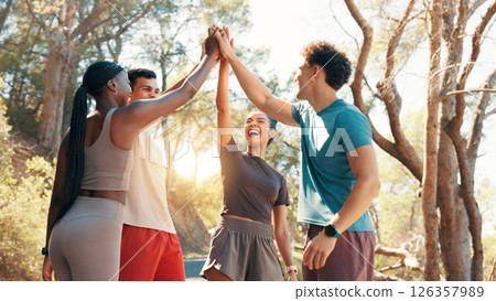 Happy people, fitness and high five in huddle for workout goals, winning or teamwork in nature. Active, group or friends with smile or motivation for success, exercise or health and wellness together 126357989
