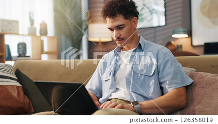 Remote work, man and laptop in home for research, email draft or creative writing on sofa. Freelance writer, tech or connectivity in living room for article editing, proofreading story or publication 126358019