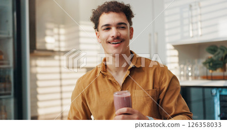 Man, thinking and smile in home with smoothie, protein shake and beverage for gut health. Nutritionist, happy and glass in kitchen with detox drink, vitamin booster and benefits of meal supplement 126358033
