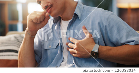 Man, cough and chest pain with illness for asthma, influenza or bronchitis on sofa at home. Male person, sick or heart burn with ache or cramp for discomfort, cardiac arrest or symptoms at house Man, cough and chest pain with illness for asthma, influenza or bronchitis on sofa at home. Male person, sick or heart burn with ache or cramp for discomfort, cardiac arrest or symptoms at house 126358034