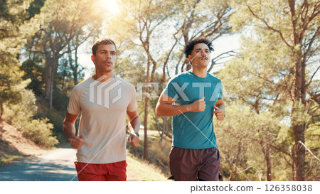 Men, running or fitness with workout in nature for exercise, marathon or training together. Active, male people or runners with path, trail or road on mountain for race, sprint or health and wellness 126358038