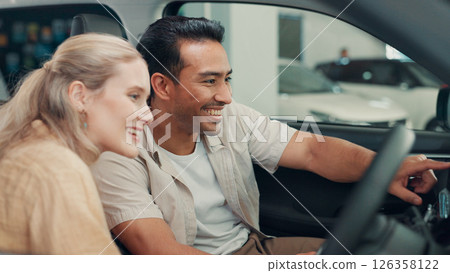 Smile, dealership and couple in new car for purchase on transport with test drive of vehicle. Happy, evaluation and man with woman for decision on automotive shopping with positive choice together. 126358122