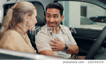 Conversation, dealership and couple in new car for purchase on transport with test drive of vehicle. Smile, evaluation and people with decision on automotive shopping with positive choice together. 126358154