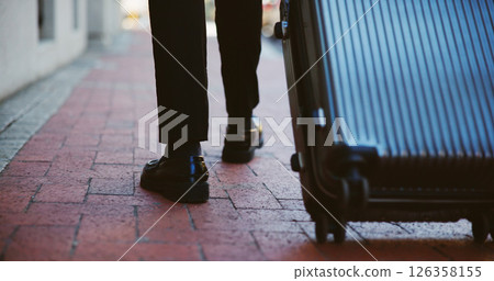 Business person, legs or walking with suitcase in city for corporate travel, destination or commute. Closeup, immigrant or shoes with luggage for job, career opportunity or work trip in an urban town 126358155