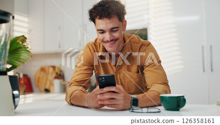 Reading, smile and man on smartphone in kitchen for communication, morning news and message. Home, online and happy person on mobile for texting, social media and website to download application 126358161