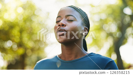 Meditation, breathe and black woman in park for mindfulness, healing aura or spiritual mental health. Zen, African girl and peaceful in nature with fresh air, energy balance or relax chakra outdoors 126358215