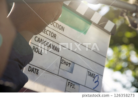 film production crew holding Film Slate on set 126358273