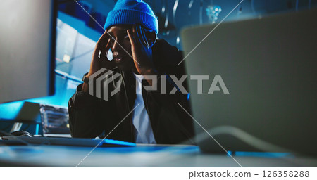Night, hacker and man with stress, computer and risk of detection, thinking and worried for failure. Contemplating, programmer and black person with anxiety for ransomware, fraud and spy in office Night, hacker and man with stress, computer and risk of detection, thinking and worried for failure. Contemplating, programmer and black person with anxiety for ransomware, fraud and spy in office 126358288