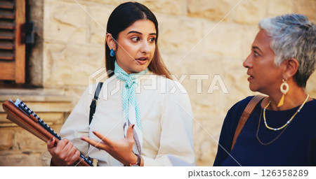 Lawyer, team and documents with business people in city for case files, trial assessment or attorney brief. Plead agreement, legal partnership and advocate paperwork with women outdoor for discussion 126358289