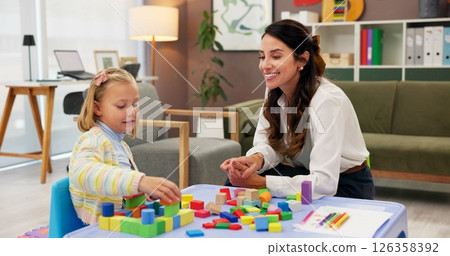Counseling, kid and building blocks with woman in psychology for consulting, child development or play therapy. Education therapist, advice and mental health evaluation with person and girl with toys Counseling, kid and building blocks with woman in psychology for consulting, child development or play therapy. Education therapist, advice and mental health evaluation with person and girl with toys 126358392