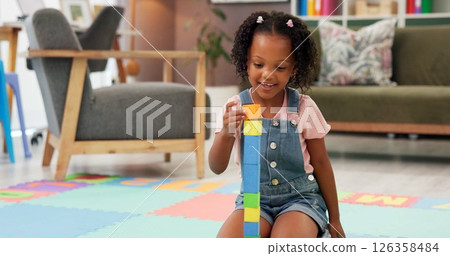 Black girl, block and building with toys for fun activity or playing on floor at therapy office. Kindergarten kid, child or student with shapes for playful learning, fine motor skills or education Black girl, block and building with toys for fun activity or playing on floor at therapy office. Kindergarten kid, child or student with shapes for playful learning, fine motor skills or education 126358484