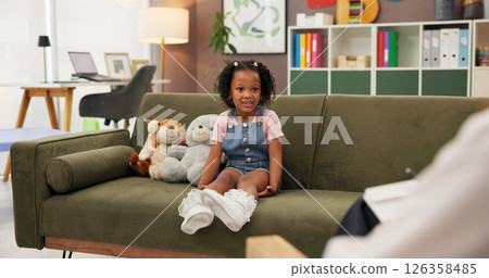 Psychologist, girl and therapy session in office for mental health, examination or progress. Therapist woman, listen and child for wellness, clinic or consultation for patient support or development 126358485