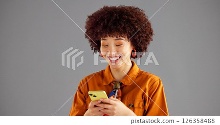 Studio, fashion and woman with smartphone, texting and browsing on social media, mockup space and online. Gray background, typing and person with mobile for message, communication and smile for chat Studio, fashion and woman with smartphone, texting and browsing on social media, mockup space and online. Gray background, typing and person with mobile for message, communication and smile for chat 126358488