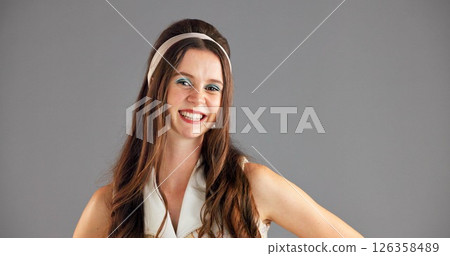 Happy woman, portrait and fashion with makeup in studio for retro or vintage clothing on a gray background. Face, female person or model with smile in stylish outfit or costume on mockup space Happy woman, portrait and fashion with makeup in studio for retro or vintage clothing on a gray background. Face, female person or model with smile in stylish outfit or costume on mockup space 126358489