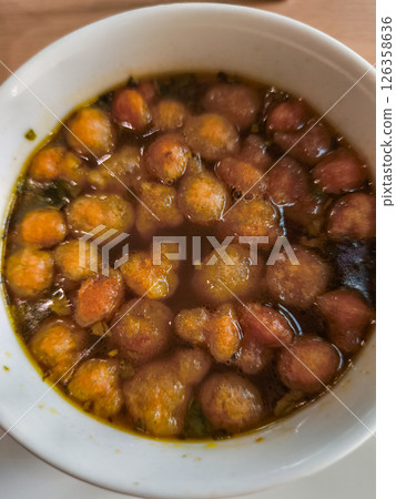 Traditional chicken soup in a steaming bowl Traditional chicken soup in a steaming bowl 126358636