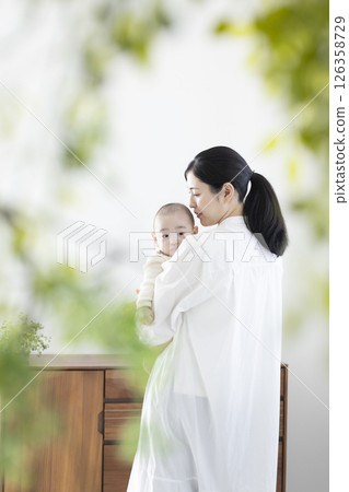 Mother holding a baby Mother holding a baby 126358729