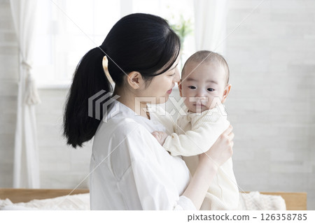 Mother holding a baby 126358785