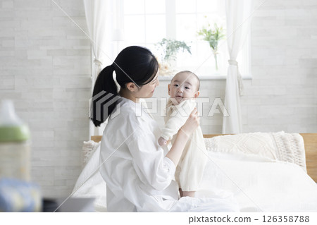Mother holding a baby Mother holding a baby 126358788