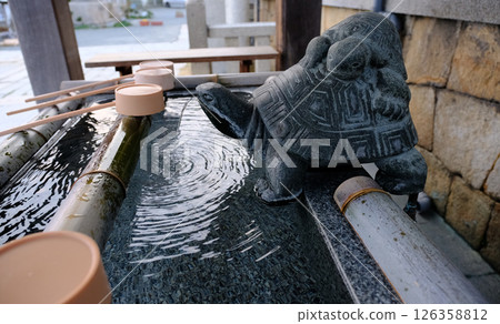 Shimonoseki, Yamaguchi Prefecture - Purify yourself at the chozuya (water purification fountain) of the historic Shimonoseki Shrine 126358812