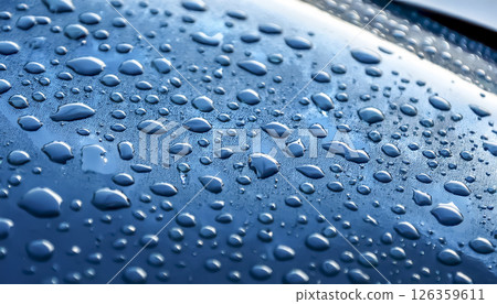 Image of water droplets and a water-repellent car hood (light blue) 126359611