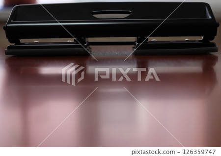 Metal hole punch. For making holes for paper. 126359747