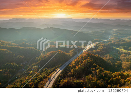 Wide multilane highway road in USA Appalachian mountains with fast driving cars. Above view of American transportation infrastructure 126360794