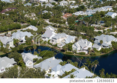 View from above of waterfront neighborhood in Florida with suburban houses. Development of US premium housing 126360813