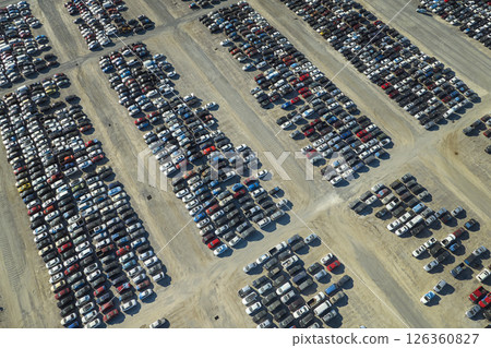 Used damaged cars on auction reseller company big parking lot ready for resale services. Sales of secondhand vehicles for rebuilt or salvage title Used damaged cars on auction reseller company big parking lot ready for resale services. Sales of secondhand vehicles for rebuilt or salvage title 126360827