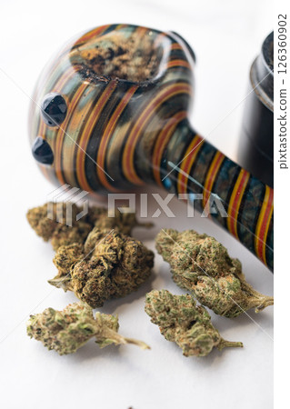 Marijuana Cannabis weed buds with pipe and grinder. Marijuana Cannabis weed buds with pipe and grinder. 126360902