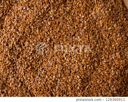 Organic golden flaxseed, linseed grains. Superfood high in fiber. Organic golden flaxseed, linseed grains. Superfood high in fiber. 126360911