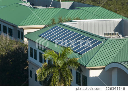 Top view of residential condo in USA with rooftop covered with solar photovoltaic panels for producing of clean ecological electrical energy. Concept of autonomous home 126361146