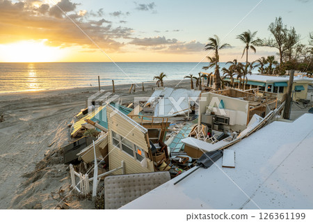 Storm surge severe damage to residential houses on ocean shore after hurricane landfall. Natural disaster consequences in Florida 126361199